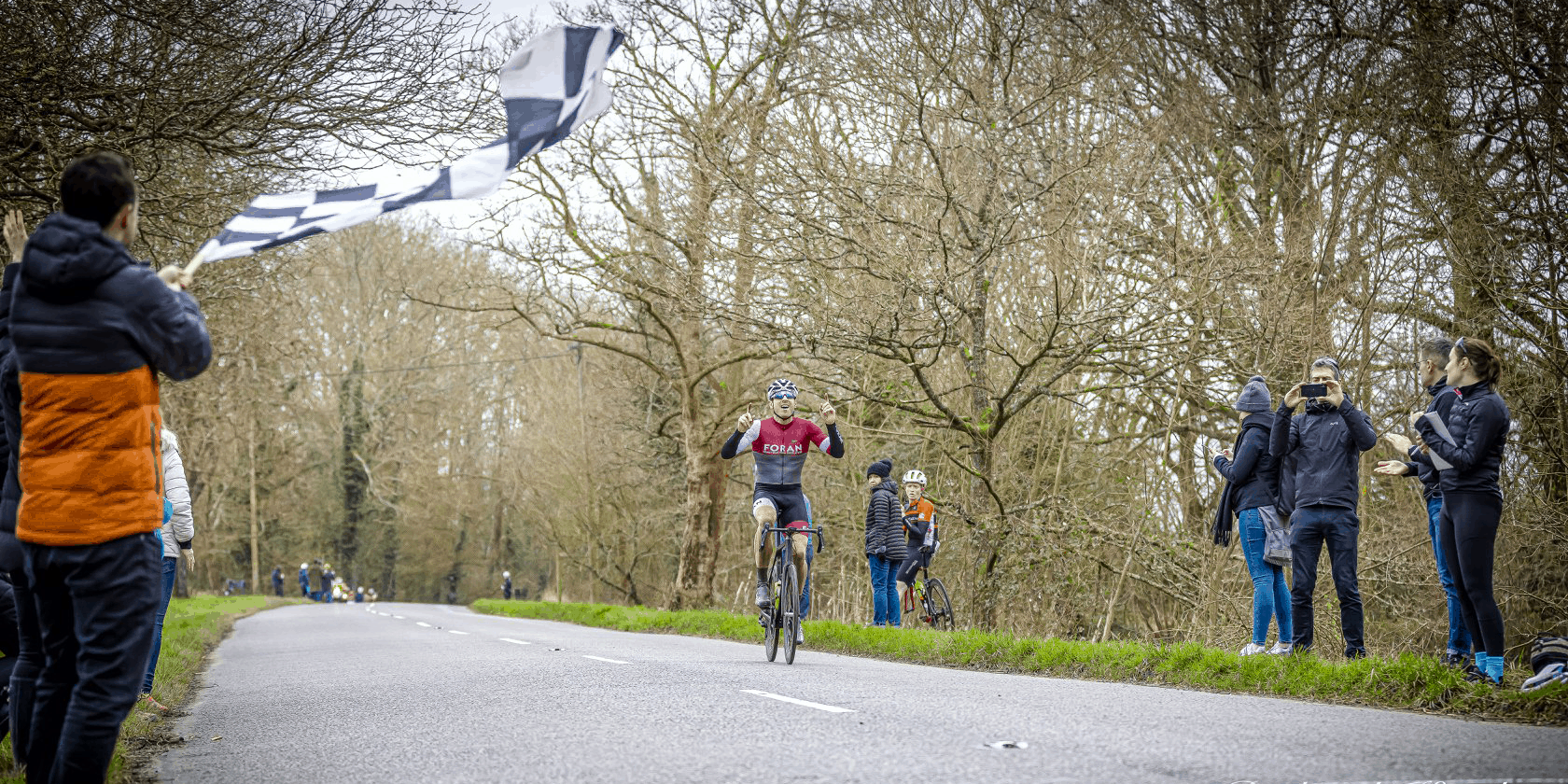 Cyclist crossing finish line